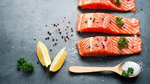 salmon steaks on kitchen board