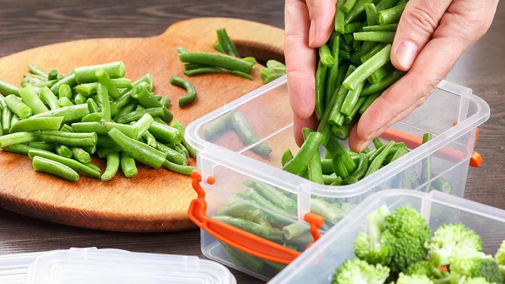 plastic containers with green vegetables