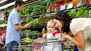 mother and child in the fruit and vegetable section at the supermarket