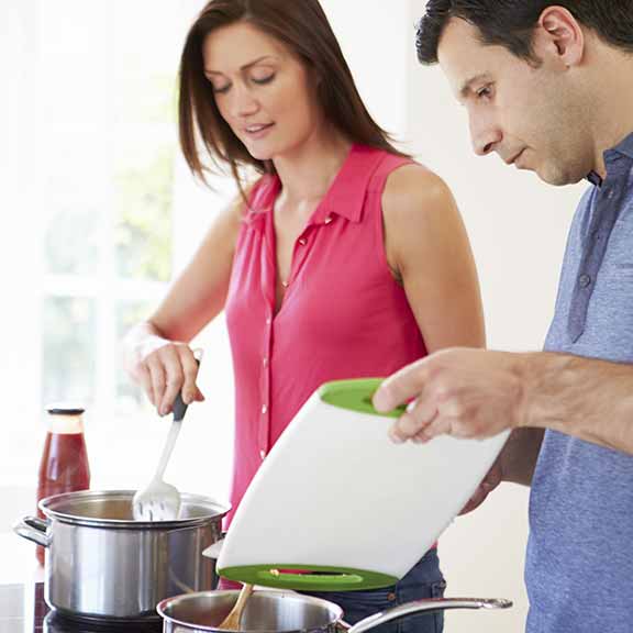 cooktops couple cooking dinner square