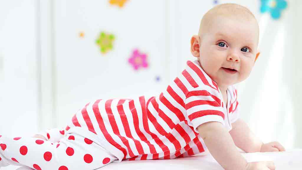 baby wears red stripey jumpsuit