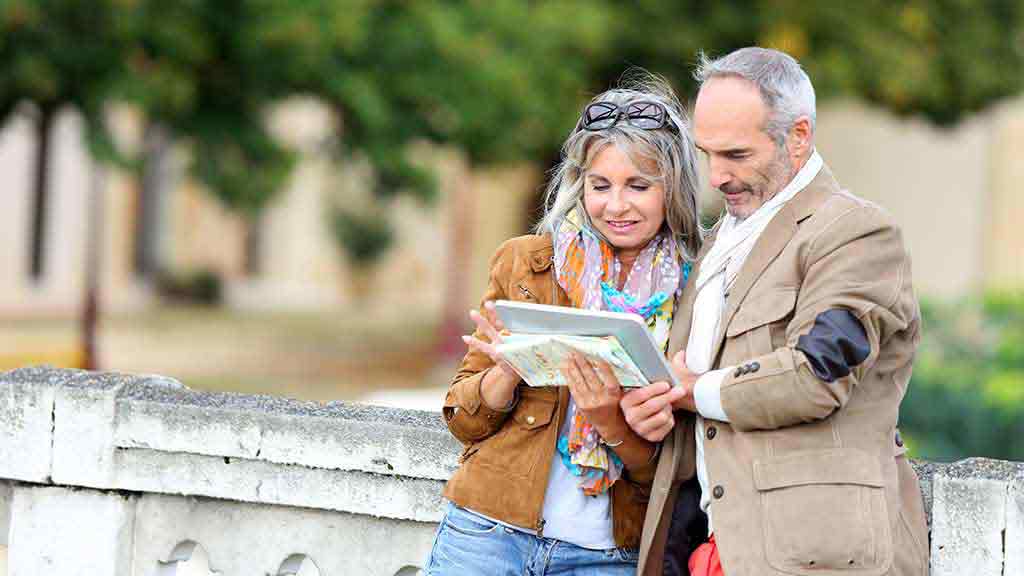 couple checking directions while travelling