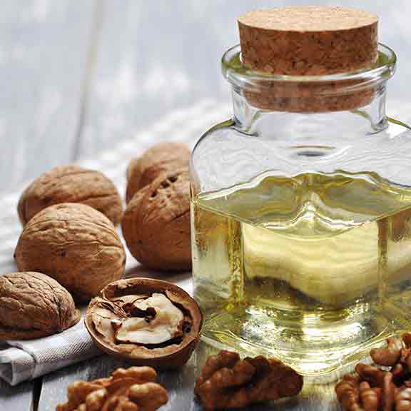 nuts and oil in a jar square