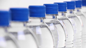 a row of lids on water bottles