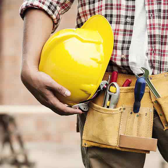 builder holds hard hat square