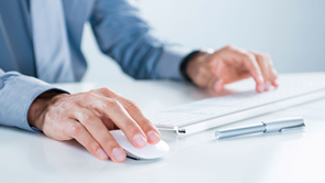 man using keyboard and mouse