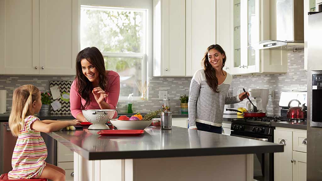 two women in kitchen with daughter landing