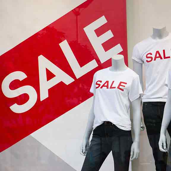 mannequins wearing shirts saying sale square