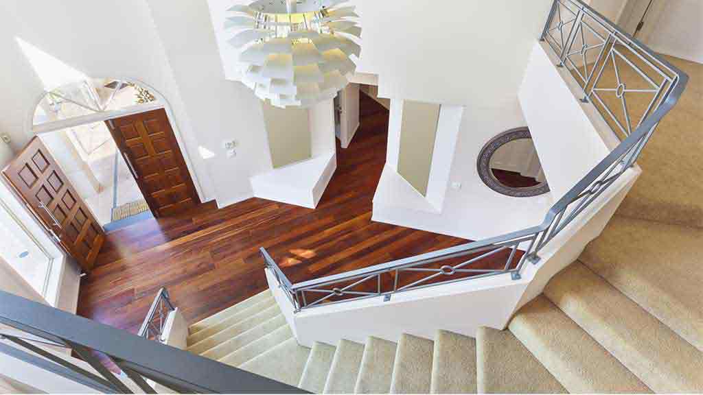 carpeted stairs and floorboards