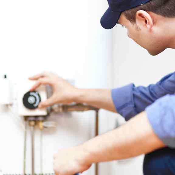 workman checking a hot water system square