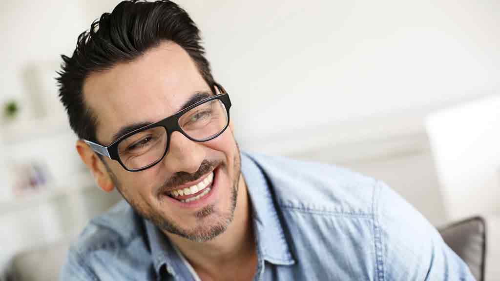 smiling man wearing glasses