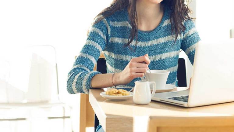woman at work breakfast biscuit