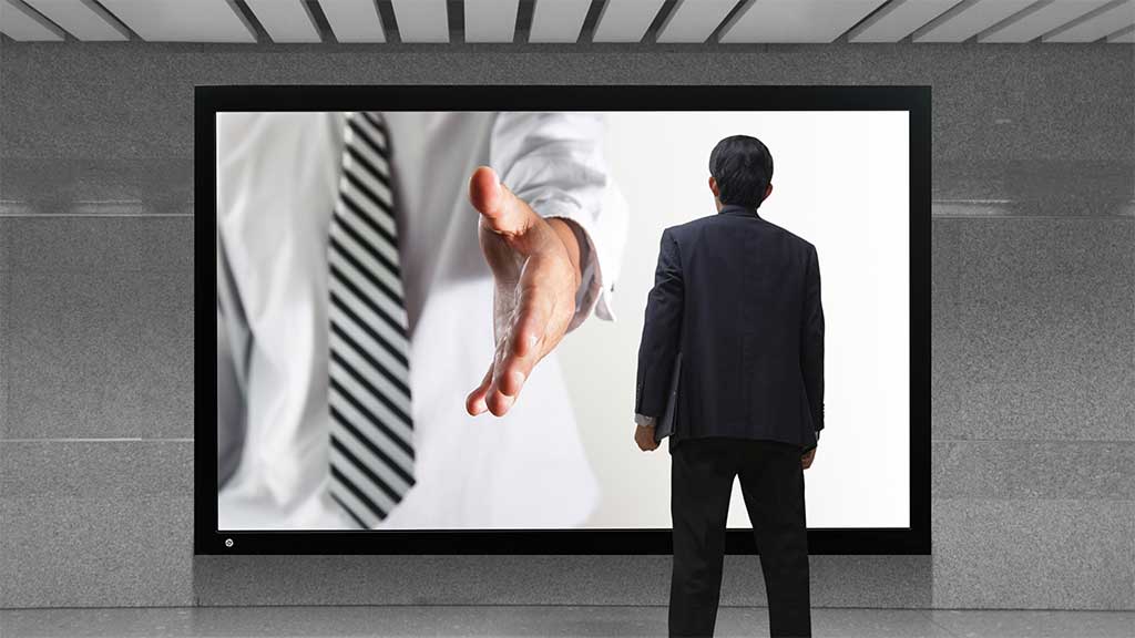 salesperson reaching out of tv