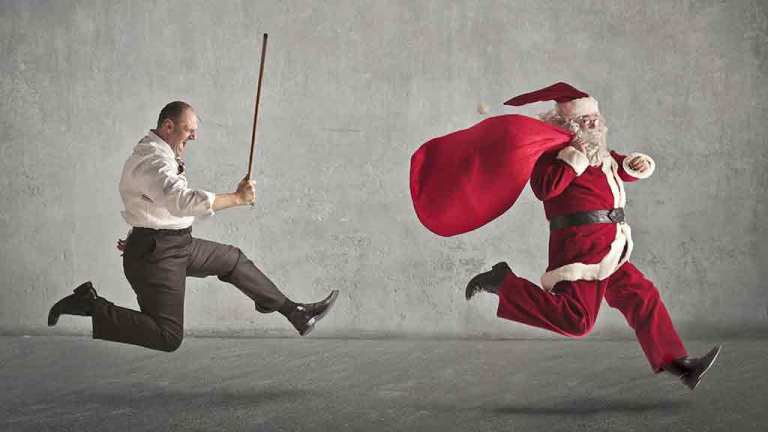 man with stick chasing santa claus