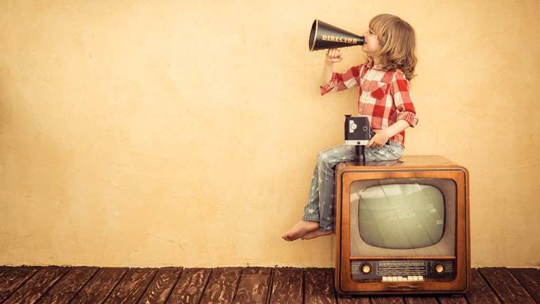 boy on retro tv with megahone and video camera