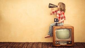 boy on retro tv with megahone and video camera