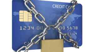 Blue credit card that has been chained up and locked with a gold padlock