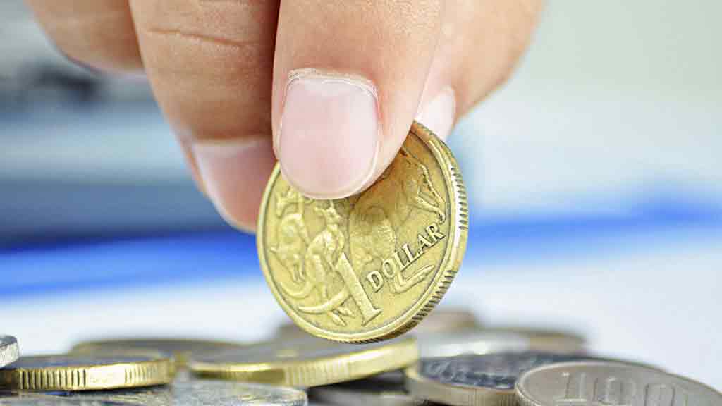 fingers picking up dollar coin