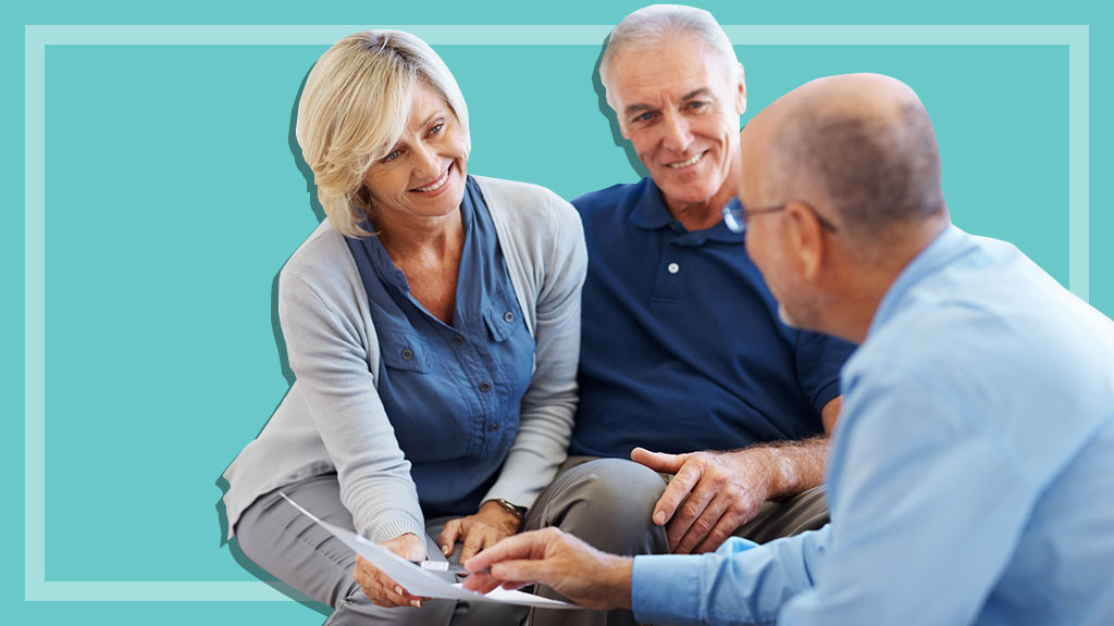 senior couple speaking with financial planner