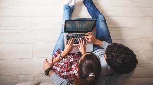 couple searching on laptop