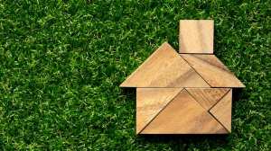 house_made_of_blocks_on_grass_background