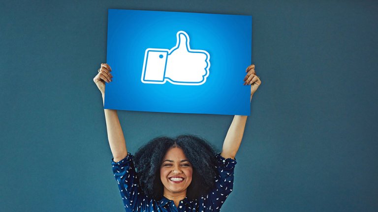woman_holding_like_sign_for_facebook