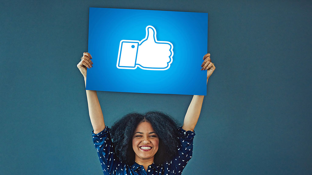 woman_holding_like_sign_for_facebook