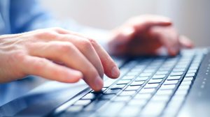 hands_typing_on_laptop_keyboard