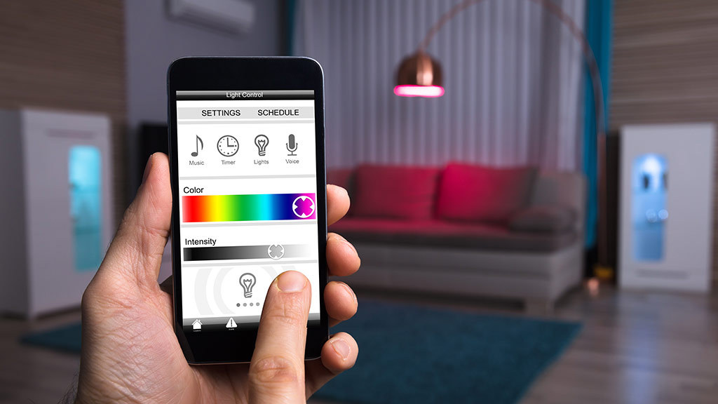 person_using_smart_light_control_with_phone