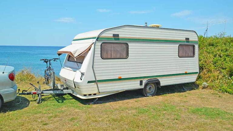 caravan parked near ocean lemon caravan