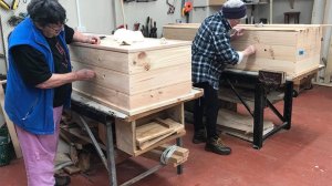 Coffin club women building coffins