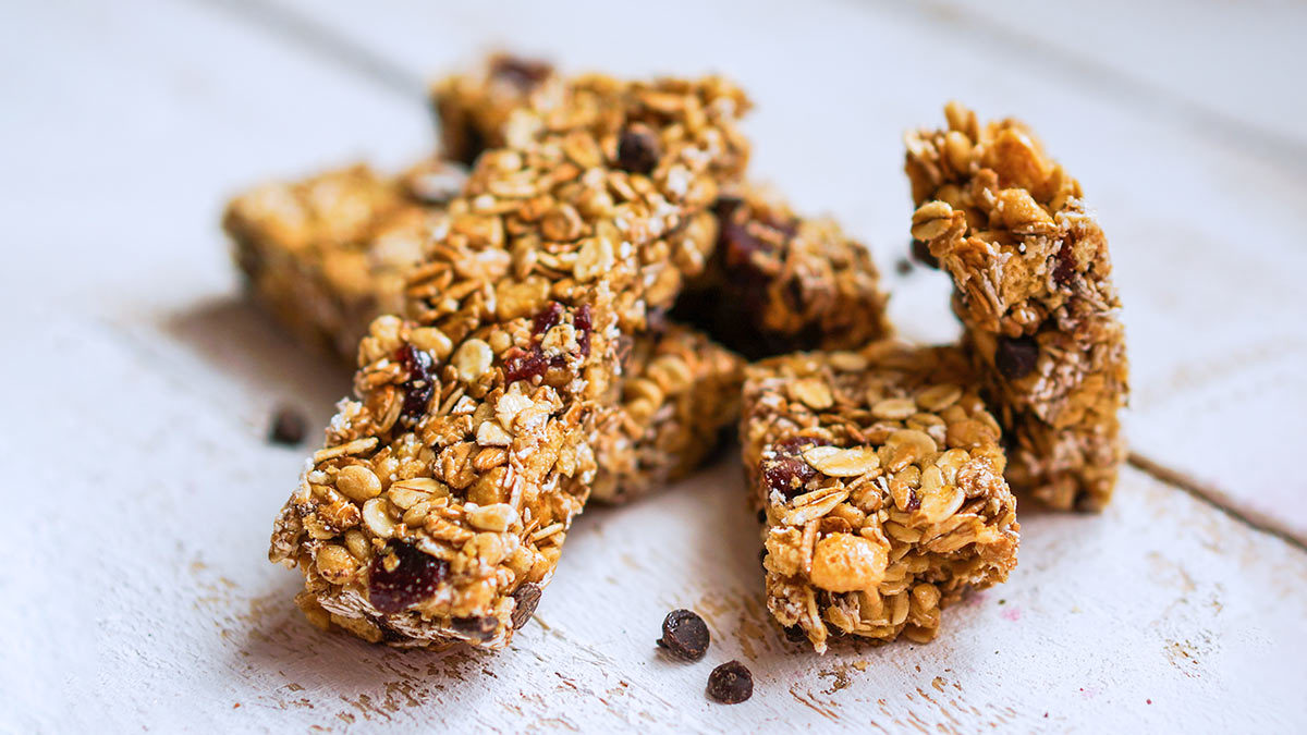 Choc chip muesli bars on wooden background