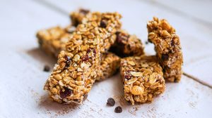 Choc chip muesli bars on wooden background