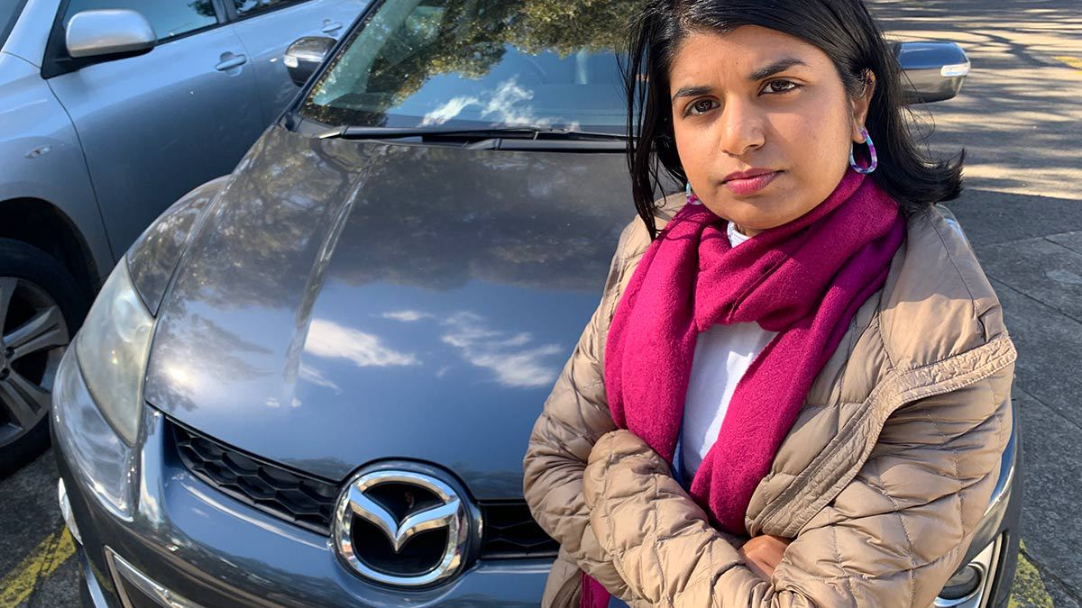 amy pereria infront of mazda car lemon car refunds