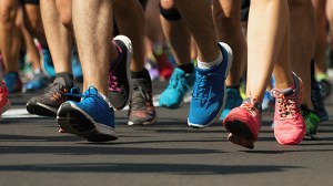 close-up on the shoe of people running