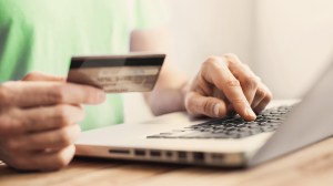 person shopping online with credit card