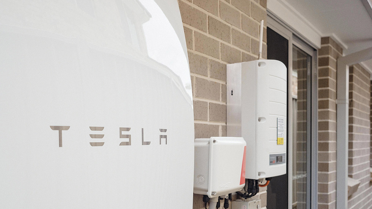 closeup of tesla powerwall on outside of pfitzner home