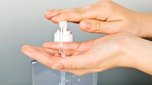 person applying hand sanitiser