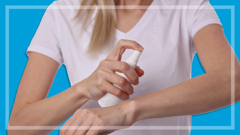 woman_spraying_insect_repellant