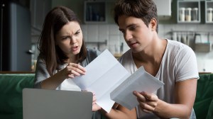 young_people_looking_at_eviction_notice