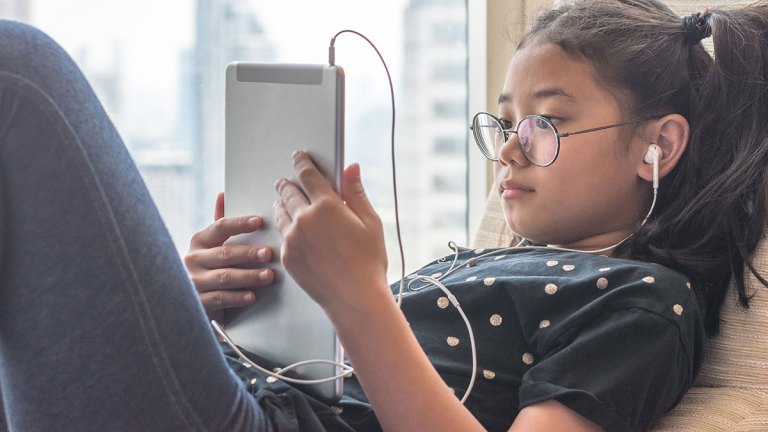 child looking at tablet