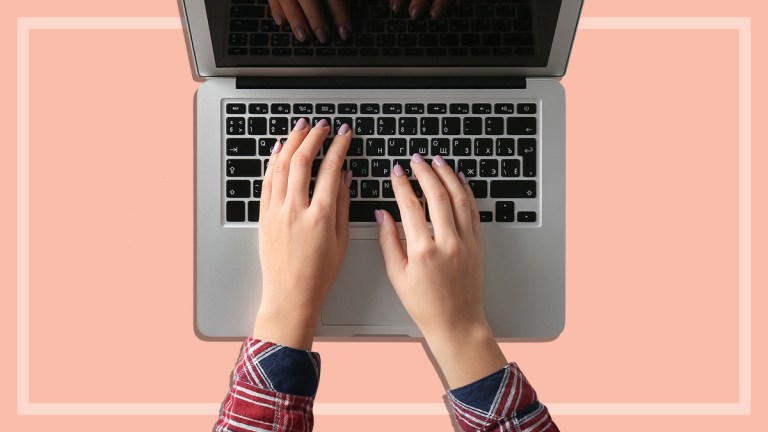 person setting up direct debits on laptop