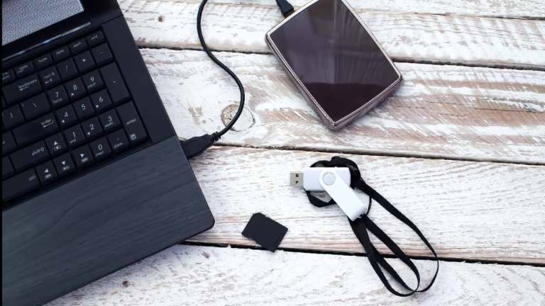 storage drives and laptop on table new