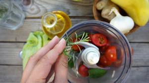 adding oil to food in a blender