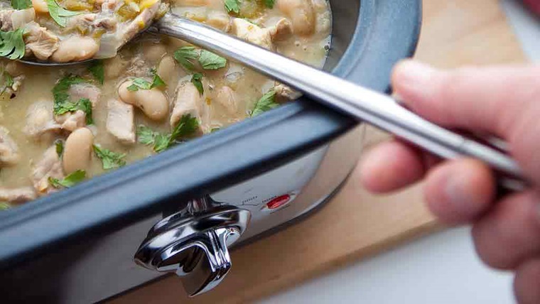 stirring stew in slow cooker