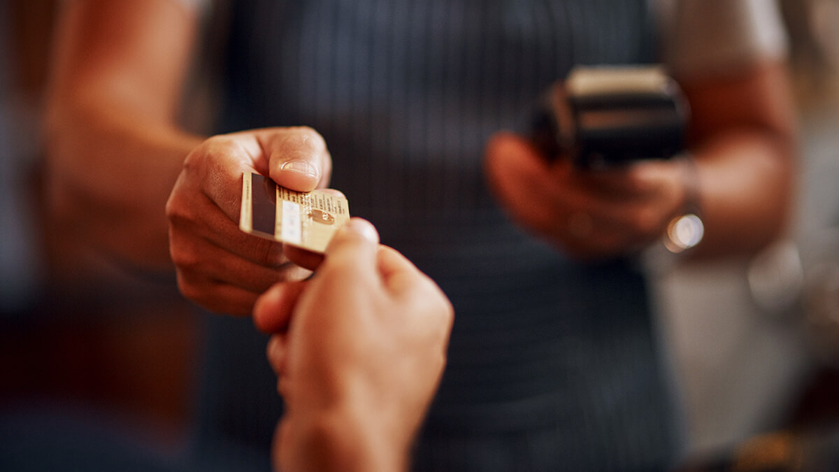 person paying for something with a credit card