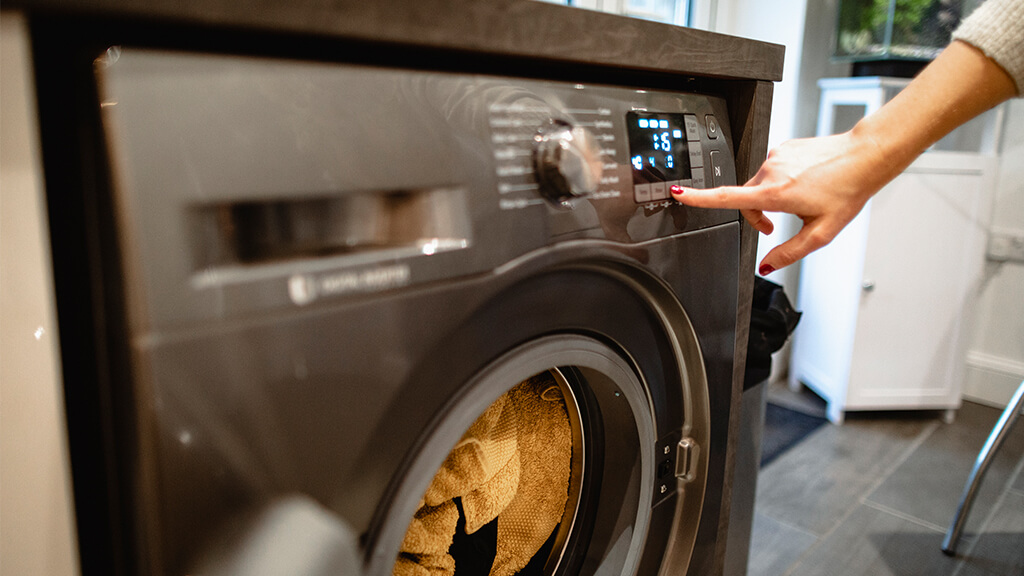 woman putting on a loading of washing