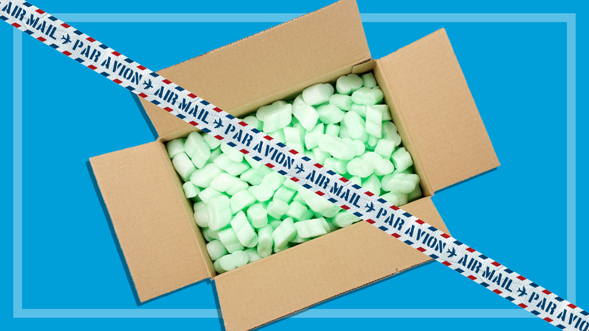 open carton full of styrofoam packing and air mail tape