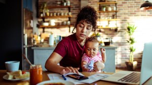 young_single_mother_working_out_finances_lead
