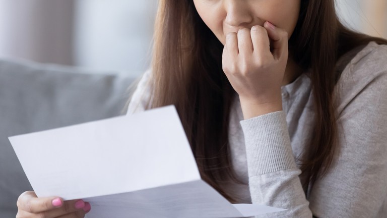 woman_reading_insurance_recovery_letter